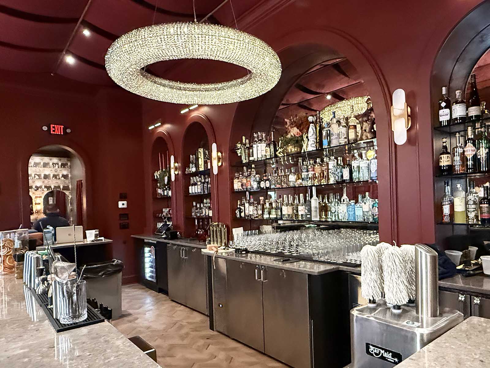 Encore Photos Working Small_0007_Layer 2 Completed cocktail bar interior at Encore Cleveland featuring custom bar construction and lighting