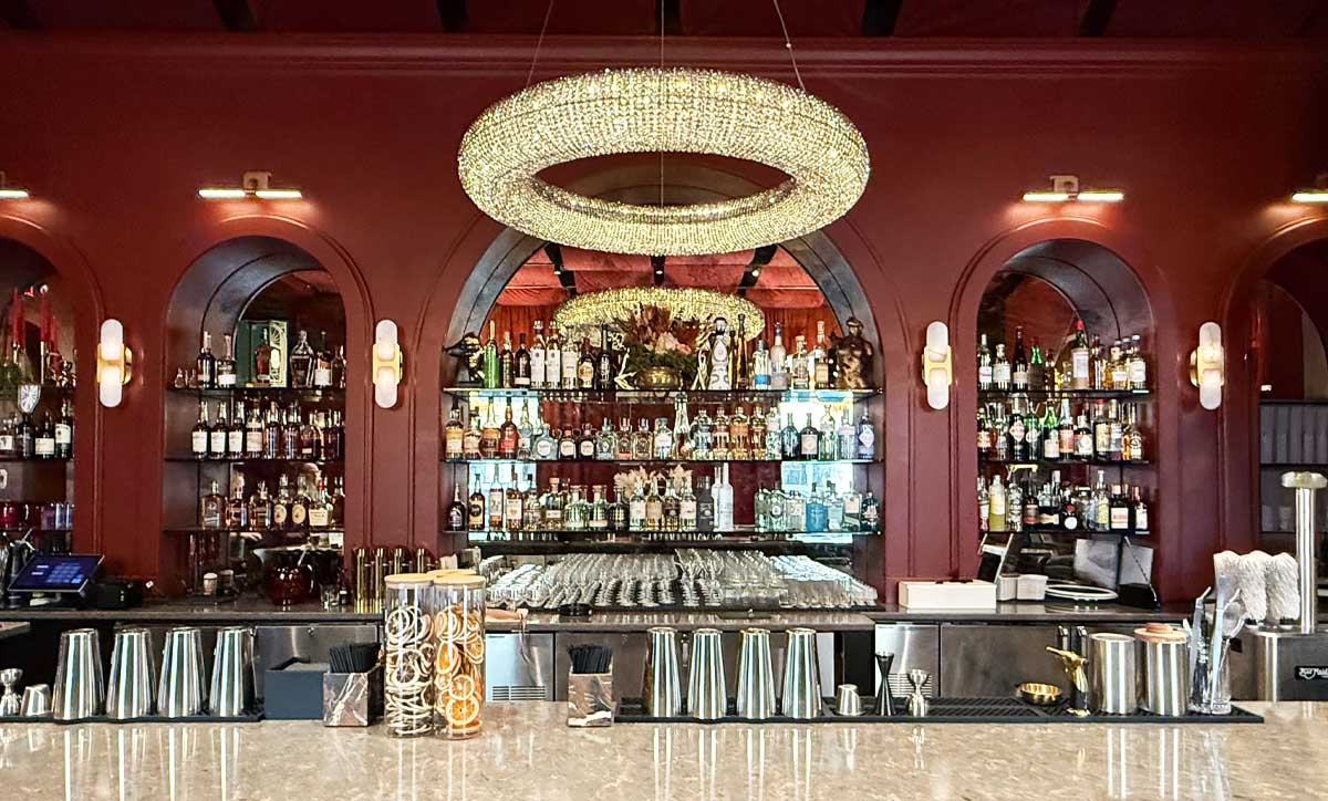 Bar back with arched, custom millwork